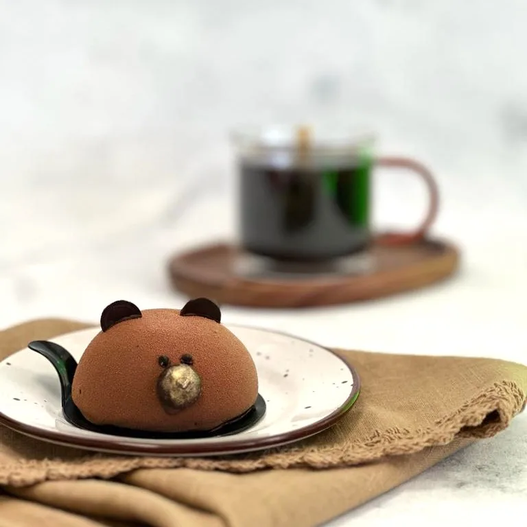 Postre con forma de oso, cubierto de chocolate